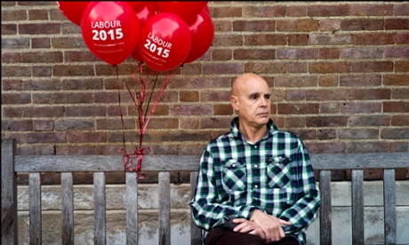 A Labour party supporter waits for Ed Milliband to address a rally in front of Hornsey Town Hall in Crouch End, North London, in the final days before the 2015 General Election.