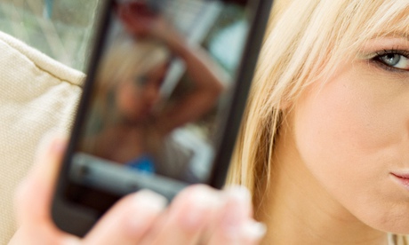 Girl taking picture with mobile phone