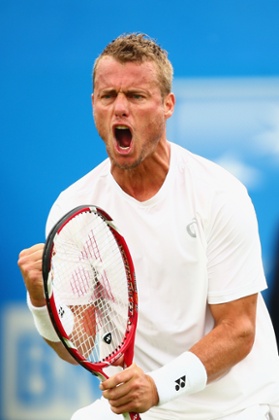 Lleyton Hewitt celebrates winning the first set.