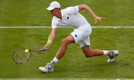 Kevin Anderson volleys in his first-round match against Lleyton Hewitt.