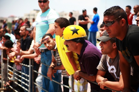 Spectators at a motorsport event in Palestine