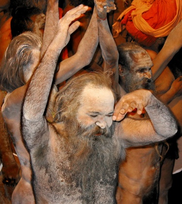 An Indian Sadhu (holy man) covered in ash celebrates the 2003 Kumbh Mela in Nashik.