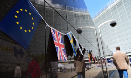 An EU flag and a British flag outside the European Commission building in Brussels. Today MPs are debating the EU referendum bill