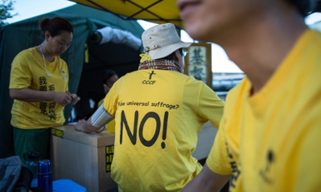A protester wears a T-shirt against 'fake universal suffrage' in a makeshift tent outside the legislative council in Hong Kong on 15 June.