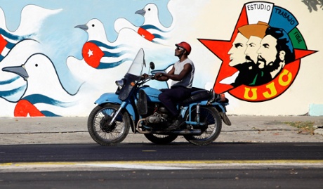 A mural by the Union of Young Communists, which reads: “Study, work, rifle.”