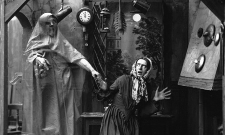 A set-up picture from the 1860's of a woman getting a scare from a transparent apparition appearing in her kitchen on the stroke of twelve. WoooOOooooo.