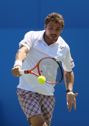 Stanislas Wawrinka plays a backhand.