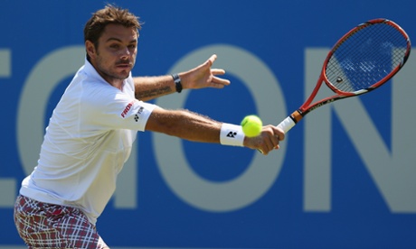 Stanislas Wawrinka plays a backhand in his men's singles first round match against Nick Kyrgios.