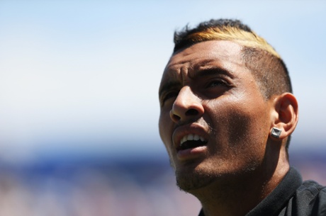 Nick Kyrgios looks on.