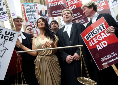 Lawyers stage a walkout and protest against proposed cuts to the legal aid budget in March 2014.