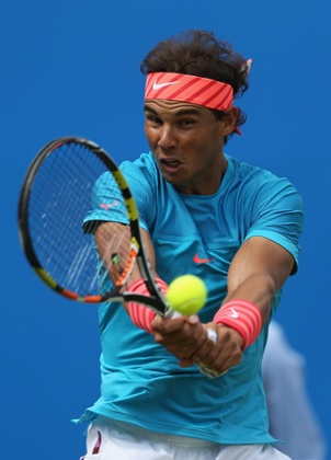 Rafael Nadal  plays a backhand.