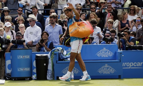 Rafael Nadal waves to the crowd as he leaves the court after losing to Alexandr Dolgopolov.