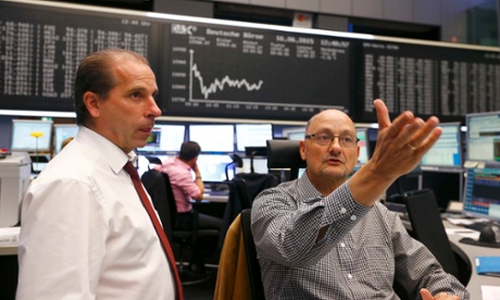 Traders at the Frankfurt stock exchange as shares recover from early losses