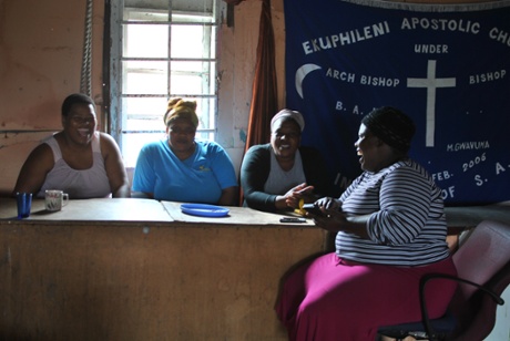 Noluthando Kapa (second left) and friends in Khayelitsha reminisce about home.