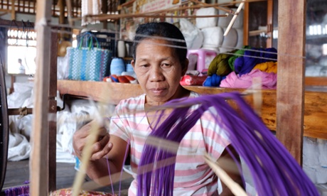 The shop may now accept modern credit cards, but it still makes silk the old-fashioned way.