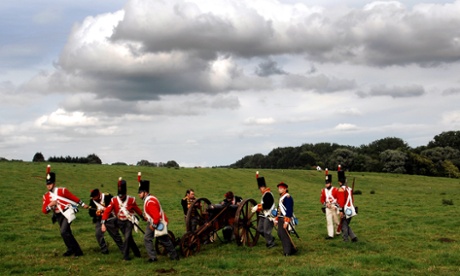 Actors dressed as soldiers pull a cannon during a re-enactment of the Battle of Waterloo near Waterloo, Belgium.