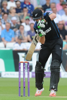 Martin Guptill drives a shot.