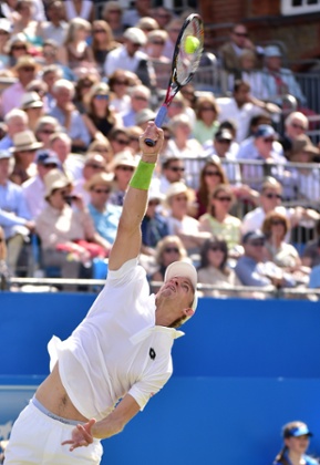 Kevin Anderson serves.