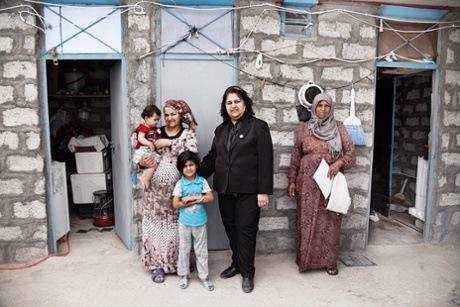 The district mayor of Darashakran, Jawan Rafiq Fathullu, meets refugees arriving in her community.