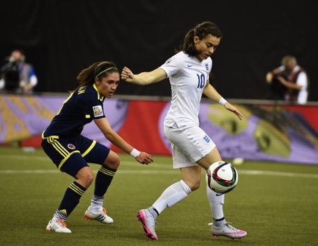 Angela Clavijo keeps a watchful eye on England's Karen Carney.