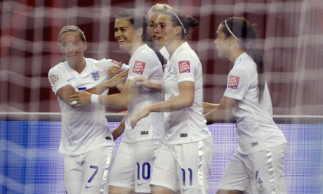 England's Karen Carney, second left, receives her team-mates's congratulations after she opened the scoring.