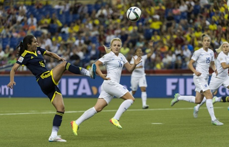 England's Alex Greenwood and Casey Stoney, right, watch as Columbia forward Lady Andrade scores a consolation goal for Colombia.