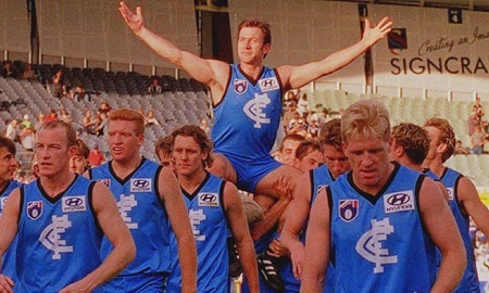 Luke O'Sullivan celebrates his 50th game for Carlton