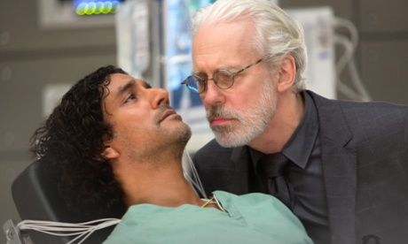 Whispers (Terrence Mann) interrogates Jonas (Naveen Andrews).
