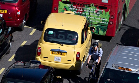 Cabs and a cyclist