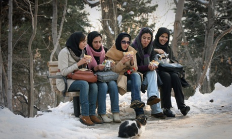 Iranian women take food in a park in Tehran, capital of Iran, Jan. 21, 2011.