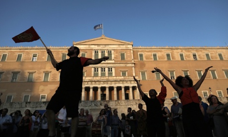 Protesters rally against austerity in front of the Greek parliament.