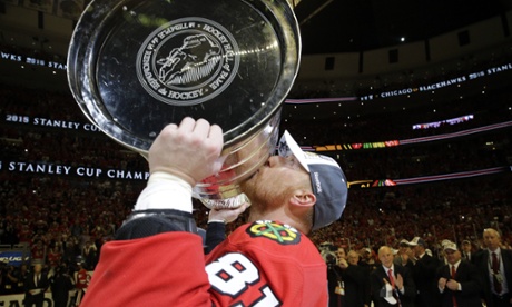 Chicago Blackhawks Marian Hossa, of Slovakia, kisses the Stanley Cup Trophy after defeating the Tampa Bay Lightning in Game 6.