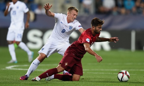 Portugal's Sergio Oliveira goes down under pressure from James Ward-Prowse.