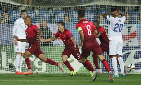 Portugal's Joao Mario celebrates scoring the opening goal.