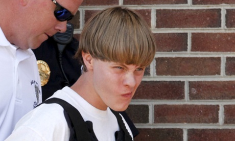 Police lead suspected shooter Dylann Roof, 21, into the courthouse in Shelby, North Carolina, June 18, 2015.