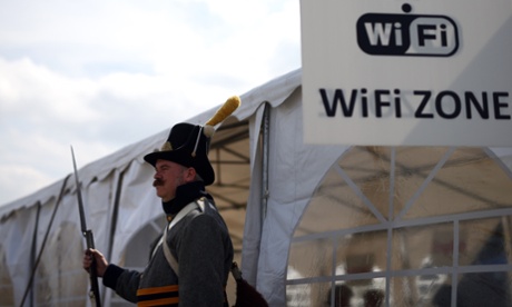 A historical re-enactor outside the Wi-Fi tent at the Allied bivouac encampment in Belgium this week – he joined 5,000 war re-enactors who took part in the 200th anniversary of the Battle of Waterloo.
