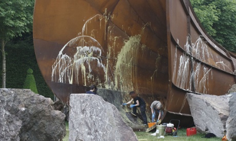 Chateau de Versailles workers clean the sculpture 