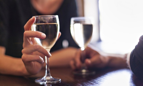 couple sitting in a bar chilled white wine mid-lfe ex-wife