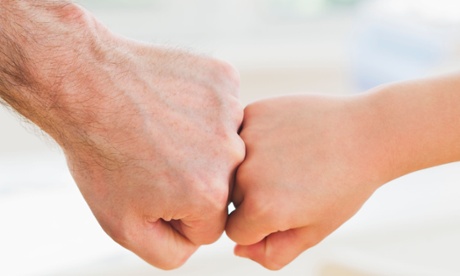 father and child fist bump