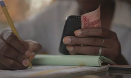 New services by Visa and other companies let migrant workers send money home more easily and cheaply by using their mobile phones.