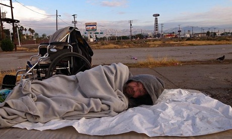  homeless man sleeps at an encampment for the homeless along Las Vegas Boulevard on October 21, 2010