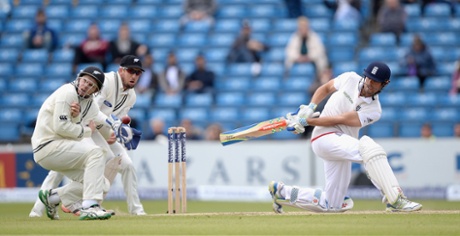 Alastair Cook hits Tom Latham with a shot.
