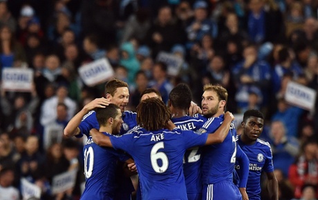Chelsea players celebrate their first goal.