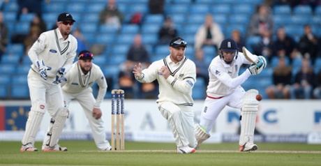 Jos Buttler hits past Brendon McCullum.
