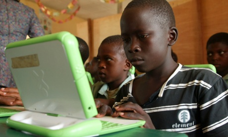 Children in Abuja, Nigeria work on computers provided by One Laptop per Child
