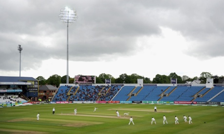 Stuart Broad bats under dark skies.
