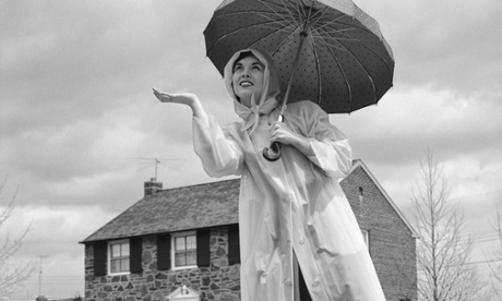Woman in raincoat with umbrella