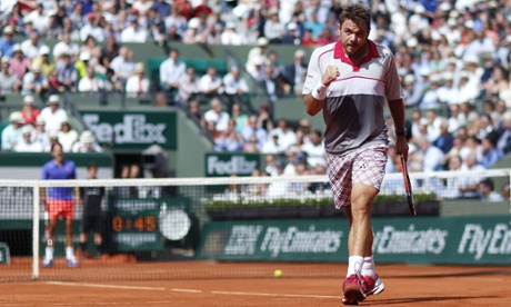 Stanislas Wawrinka reacts after winning a point against Roger Federer.