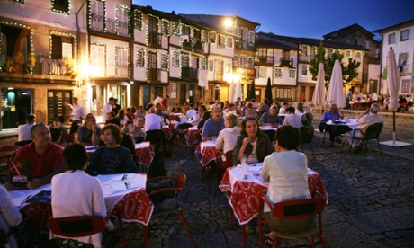 Eating out in the main square in Guimaraes, North Portugal.