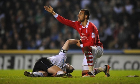Nottingham Forest's Marcus Tudgay, right, calls for assistance after Derby County's Shaun Barker goes down injured during the npower Football League Championship match at Pride Park, Derby.football soccer derby ampics